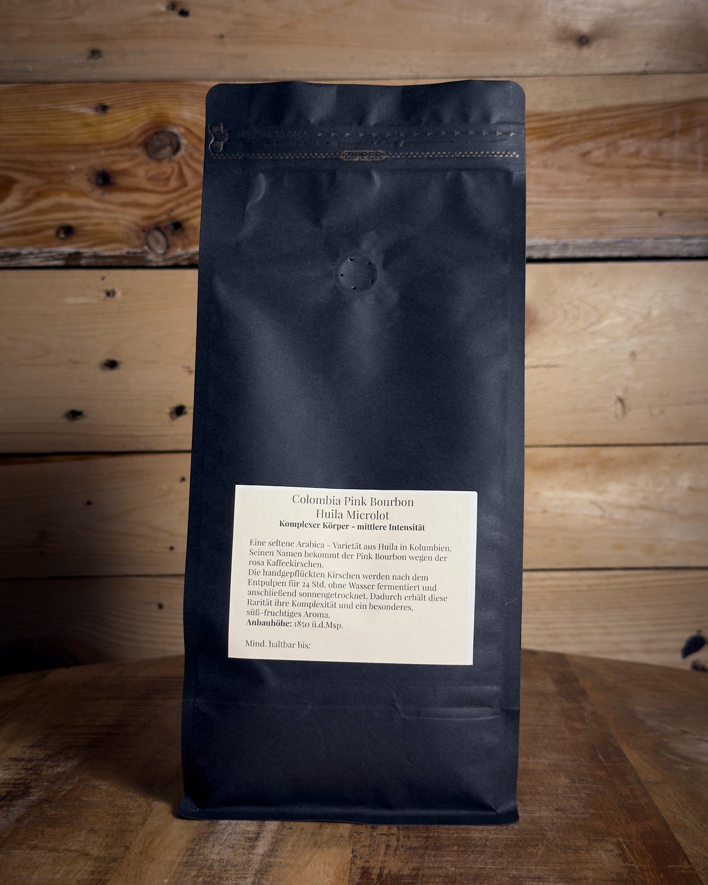 Rückseite der 1000g Packung Kolumbien Huila Microlot von KaffeeBär mit Etikett-Details.